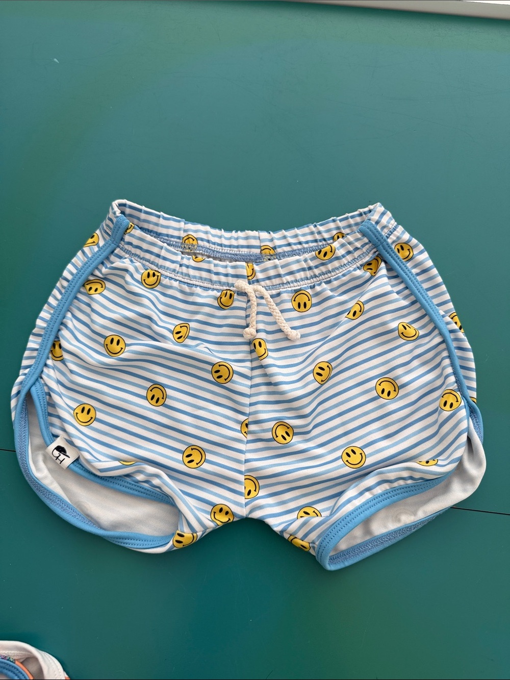 Kids Light Blue Stripe Swim Trunks with Yellow Smile Print